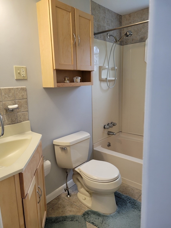 39 Daley Street Chicopee, MA 01013 - Photo 13 of 17 a bathroom with a toilet a sink and a bathtub