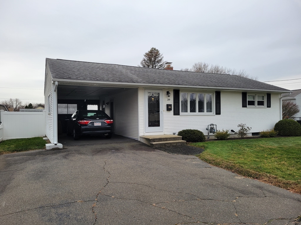 39 Daley Street Chicopee, MA 01013 - Photo 2 of 17 a view of a car parked in front of a house