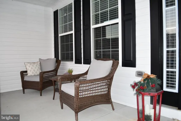 a outdoor living space with furniture and a potted plant