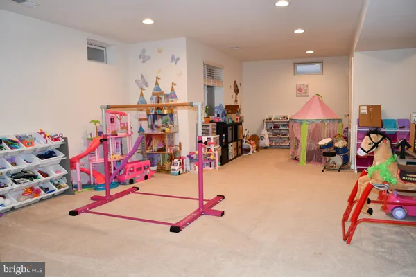 a bedroom with a bed and a view of walk in closet