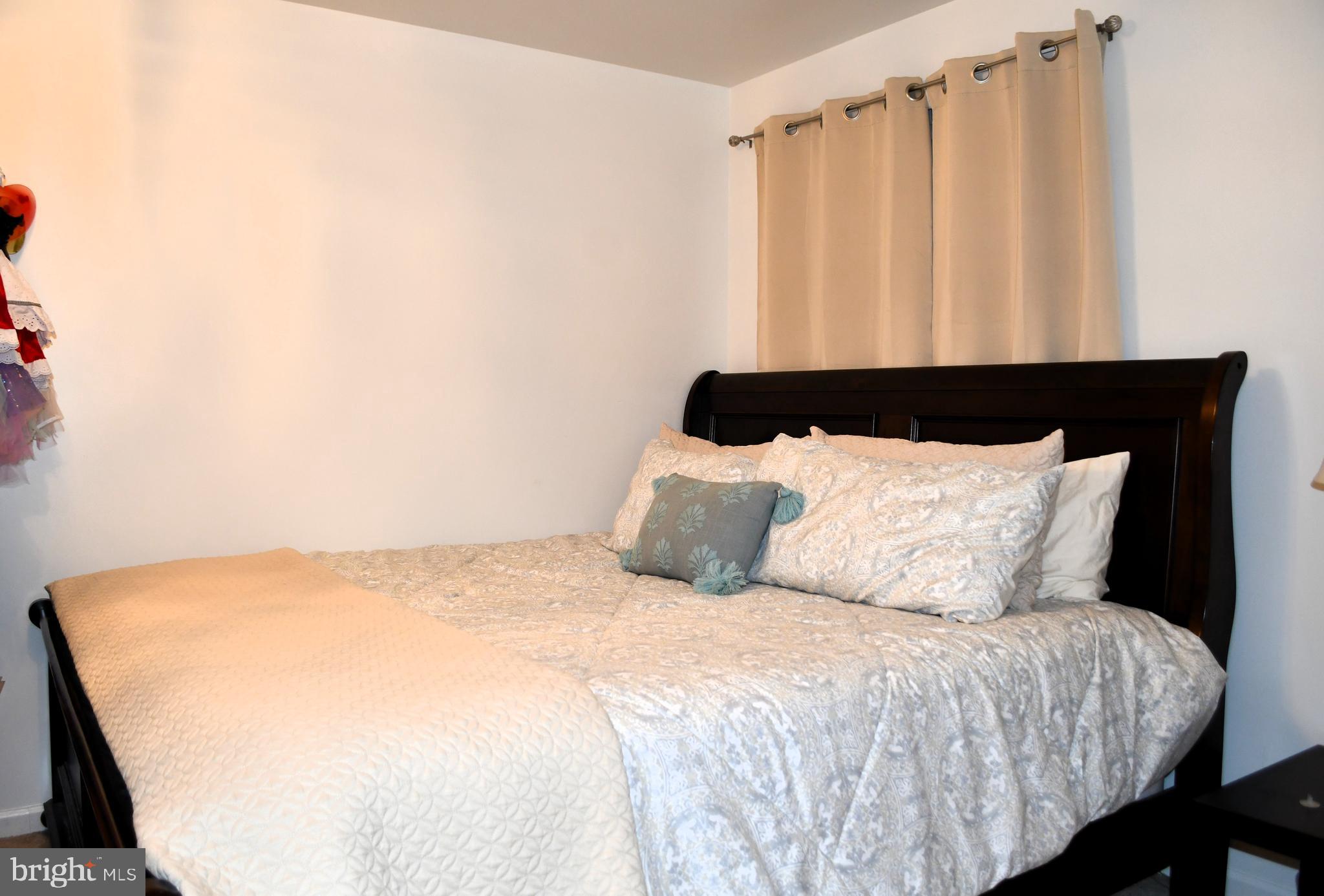 848 Chestnut Ridge Drive Magnolia, DE 19962 - Photo 27 of 38 a large bed sitting in a bedroom next to a window