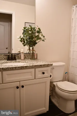 a view of a patio with couches and a dining table with chairs