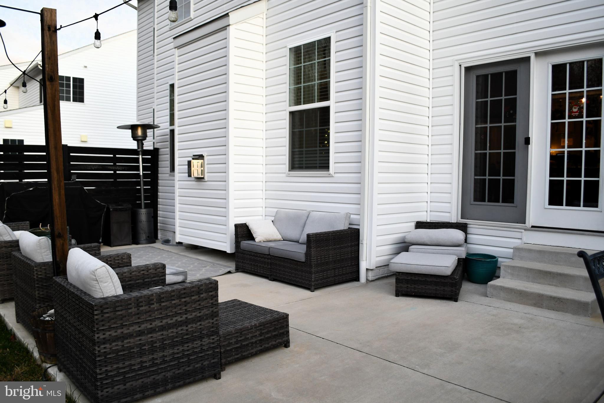 848 Chestnut Ridge Drive Magnolia, DE 19962 - Photo 32 of 38 a view of a patio with couches and a potted plant on a table