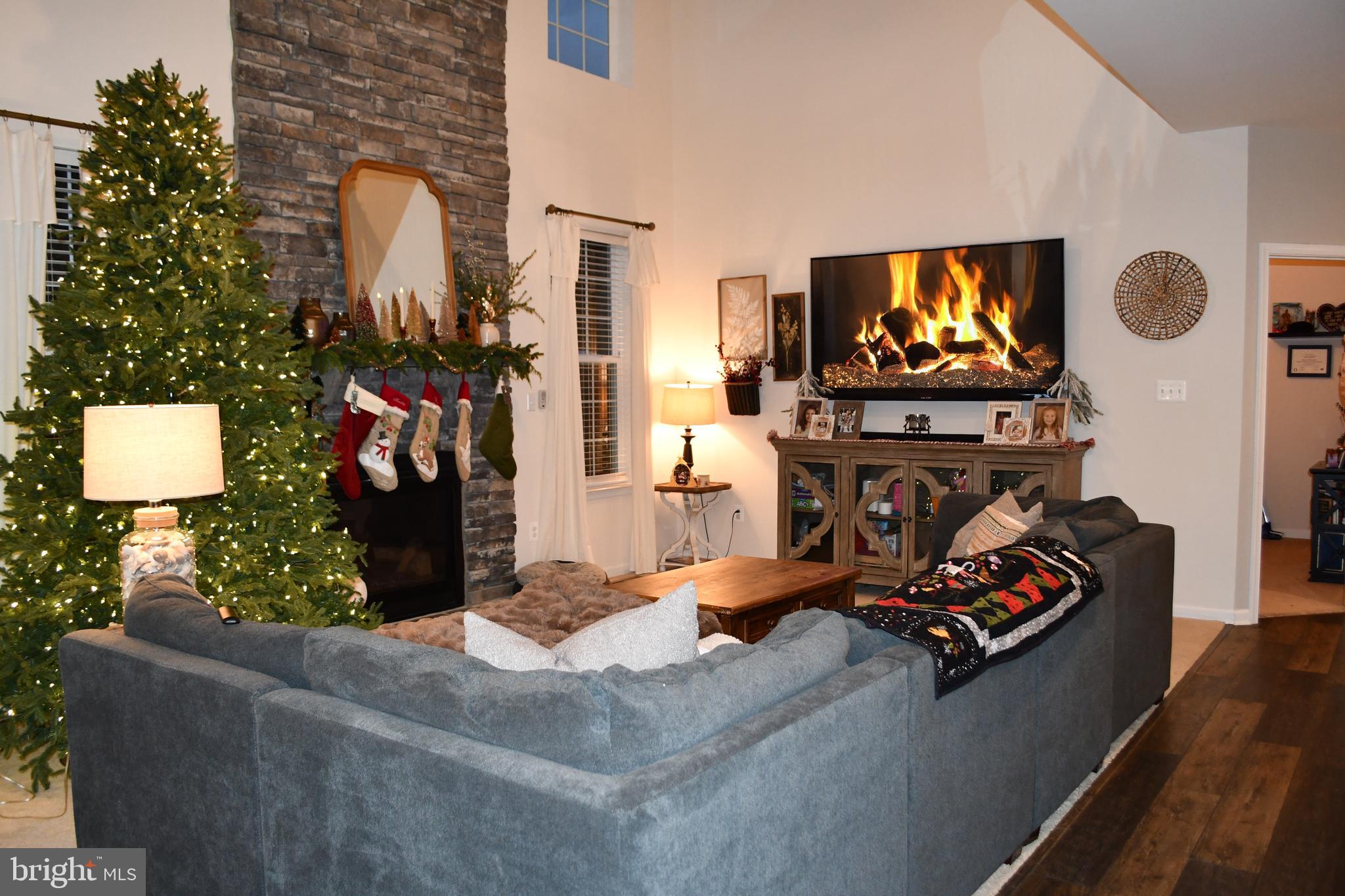 848 Chestnut Ridge Drive Magnolia, DE 19962 - Photo 9 of 38 a living room with fireplace furniture and a flat screen tv