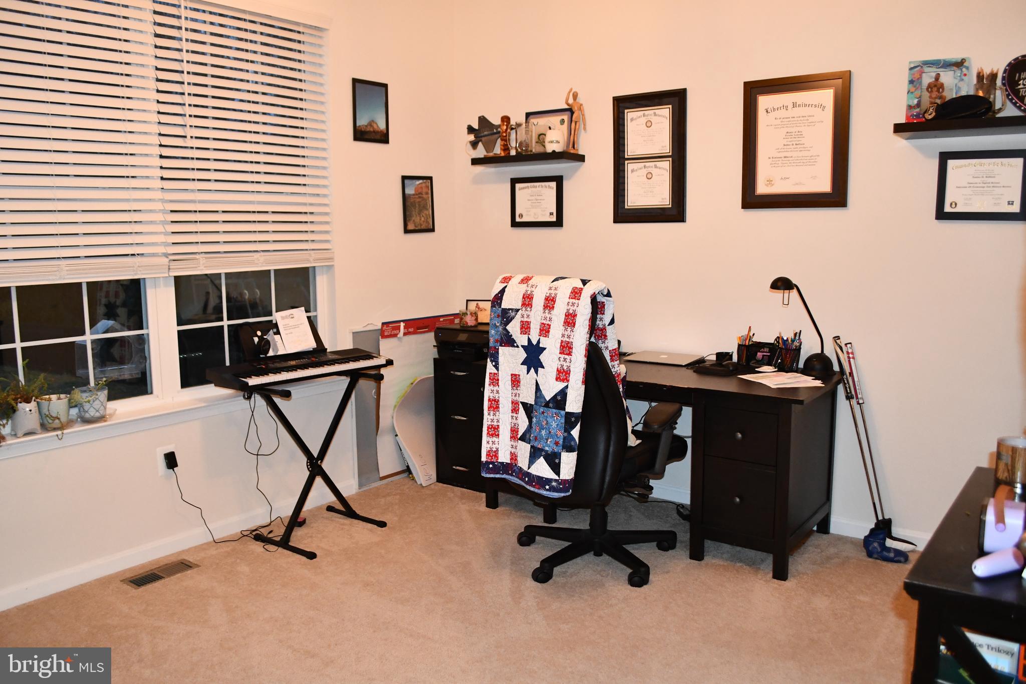 848 Chestnut Ridge Drive Magnolia, DE 19962 - Photo 10 of 38 a view of a workspace with furniture and a window