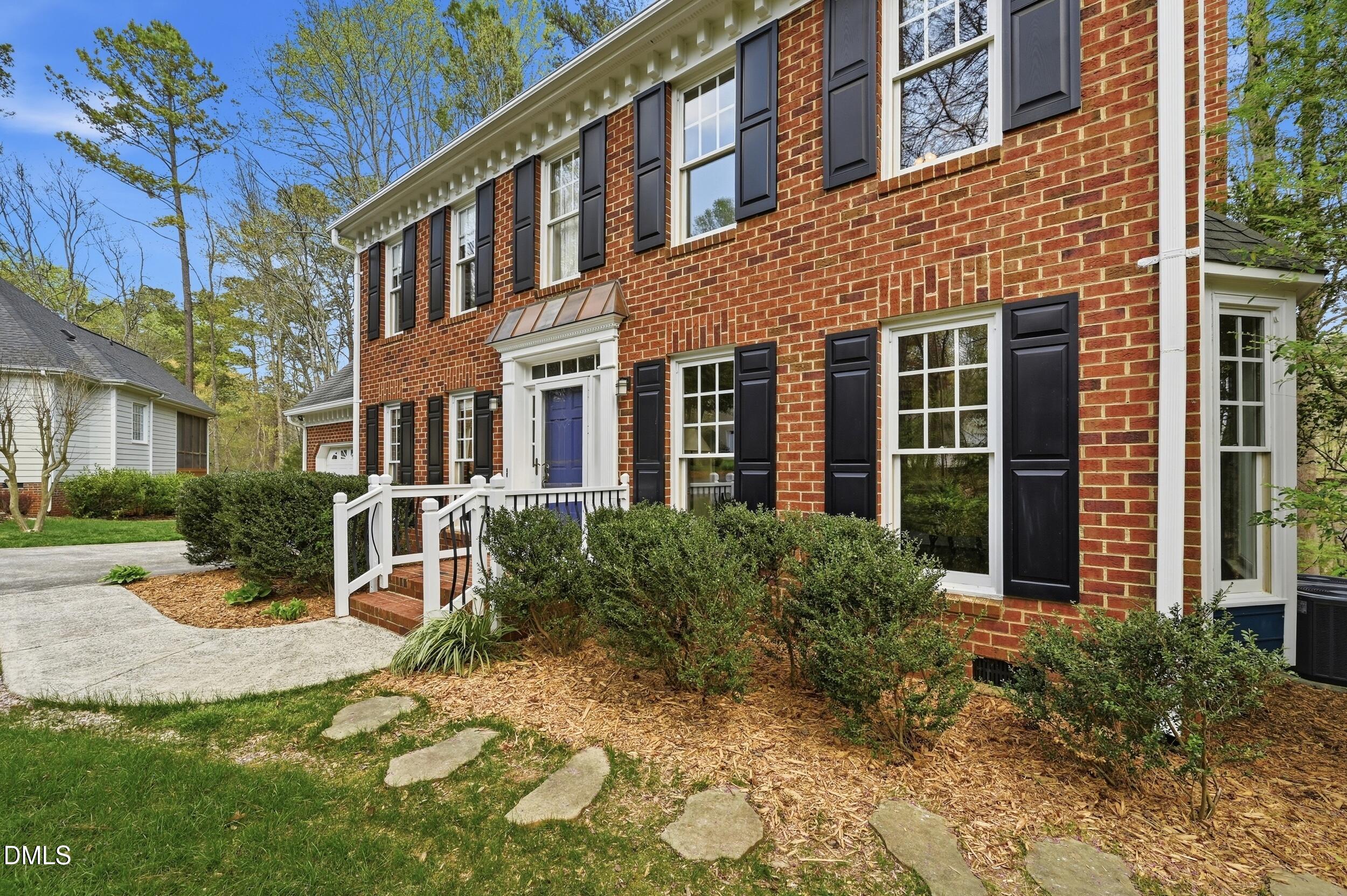 4001 Stemmons Court Raleigh, NC 27613 - Photo 40 of 45 a view of a brick building next to a yard