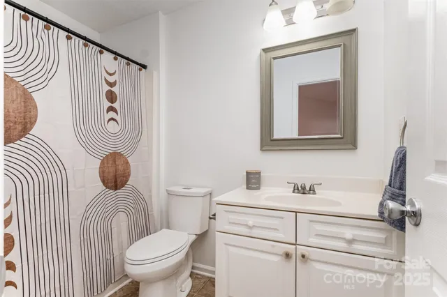 a bathroom with a toilet and a sink