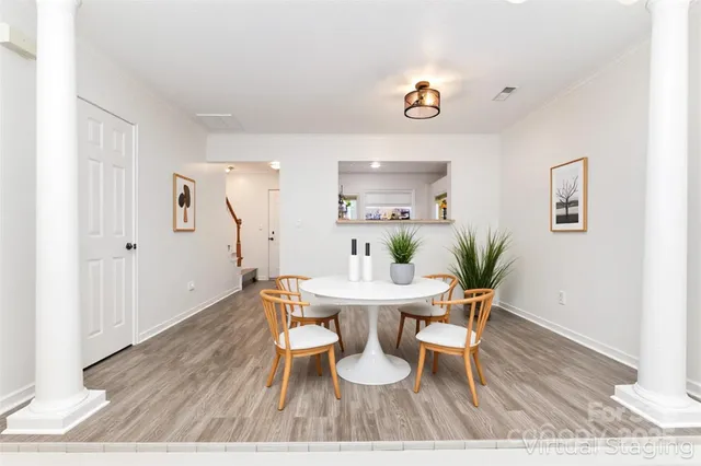 a view of a room with wooden floor and window