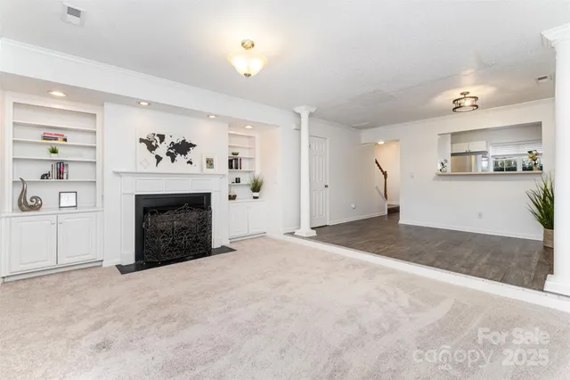 a view of a kitchen with furniture and a fireplace