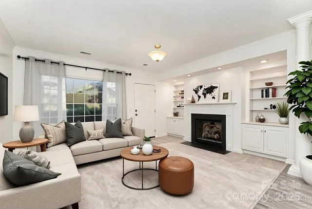 a view of empty room with a fireplace