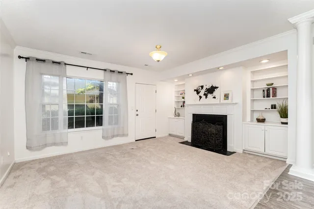 a view of a kitchen with furniture and a fireplace