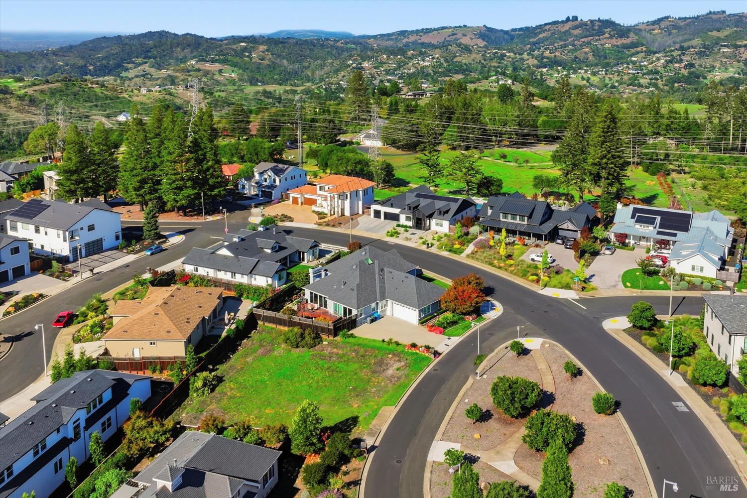 3639 Turnberry Circle Santa Rosa, CA 95403 - Photo 9 of 12 an aerial view of a house with a swimming pool yard and mountain view in back