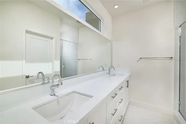 a bathroom with a sink and a white cabinet