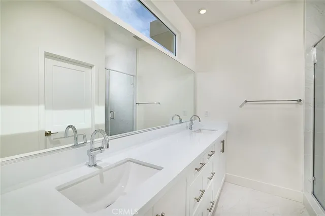 a bathroom with a sink and a white cabinet
