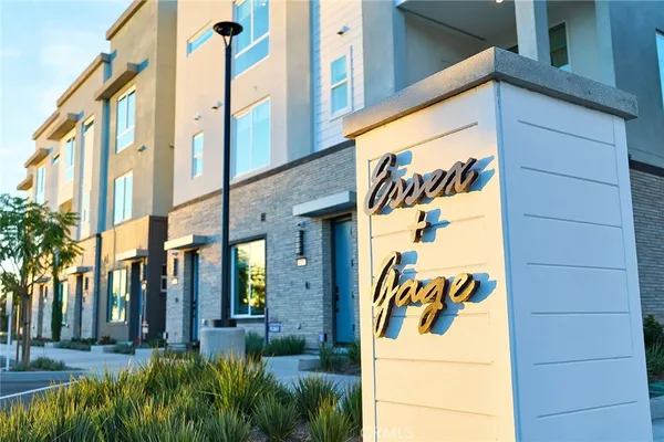 a view of a street with tall buildings