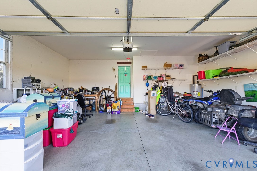 15900 Nobles Road Disputanta, VA 23842 - Photo 24 of 36 Garage with water heater