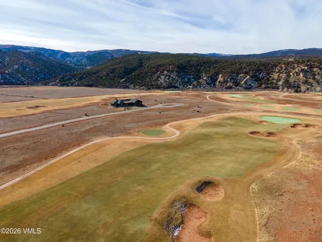a view of an ocean and a mountain