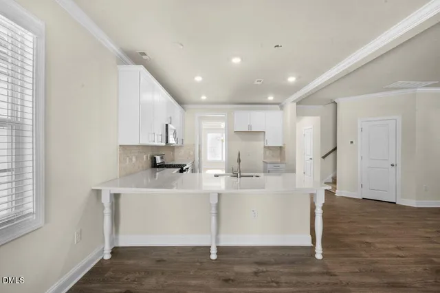 a view of kitchen with wooden floor