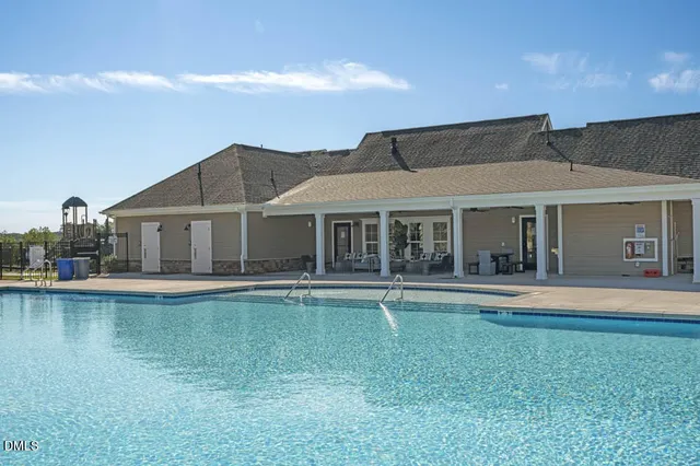 a view of swimming pool and a buildings in the background