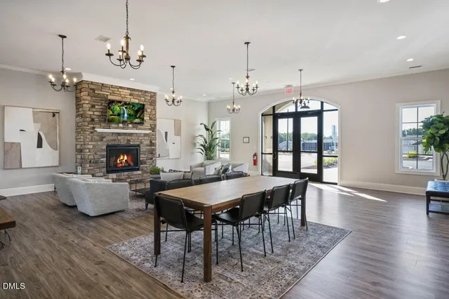 a kitchen with counter space dining table and chairs