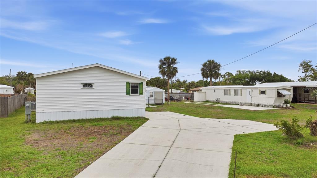 11923 Southwest Loop Terrace Arcadia, FL 34269 - Photo 43 of 50 a view of a house with a yard