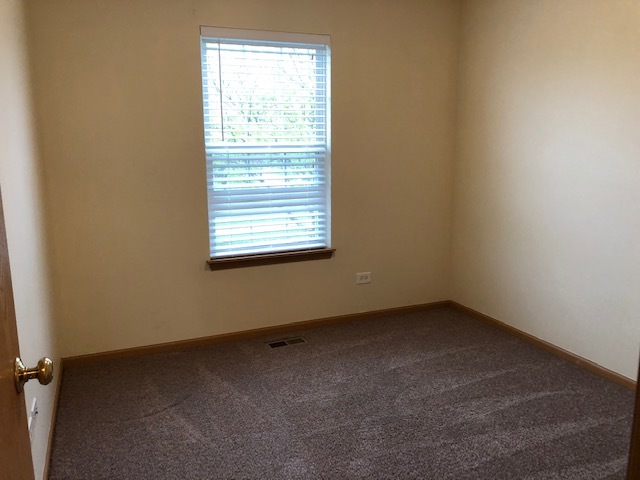 420 Kelly Court Romeoville, IL 60446 - Photo 18 of 30 an empty room with a window