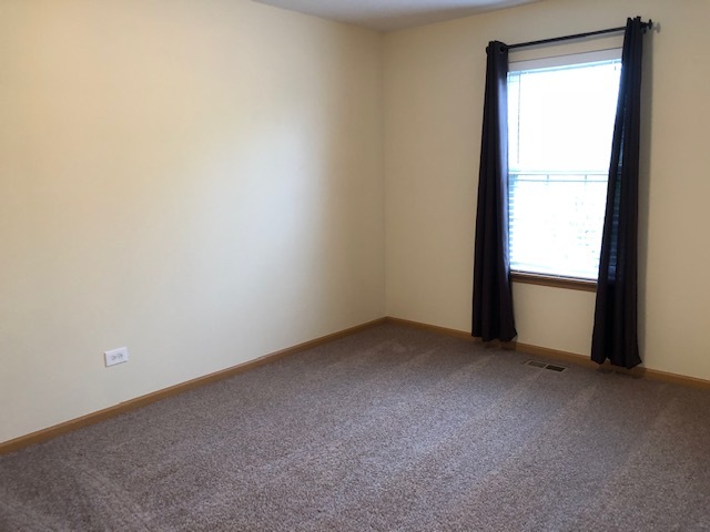 420 Kelly Court Romeoville, IL 60446 - Photo 19 of 30 an empty room with a window