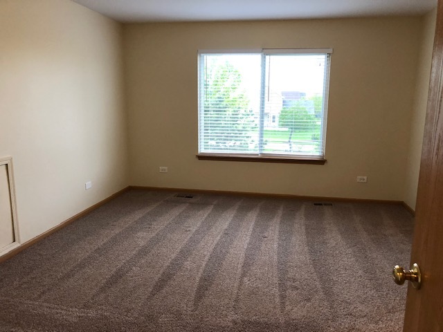420 Kelly Court Romeoville, IL 60446 - Photo 22 of 30 a view of an empty room with a window