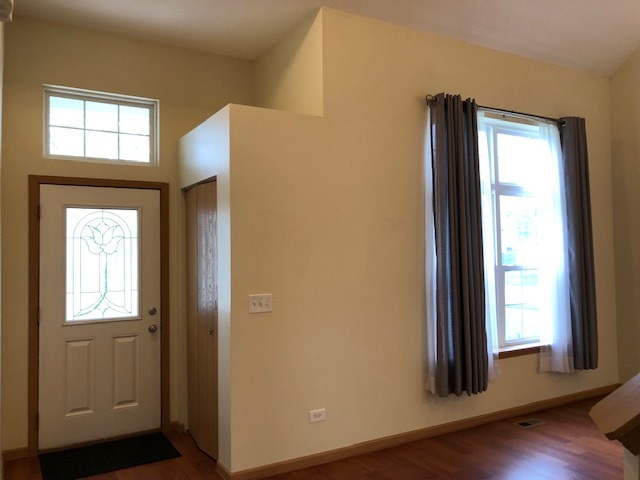 420 Kelly Court Romeoville, IL 60446 - Photo 8 of 30 an entryway with wooden floor and windows