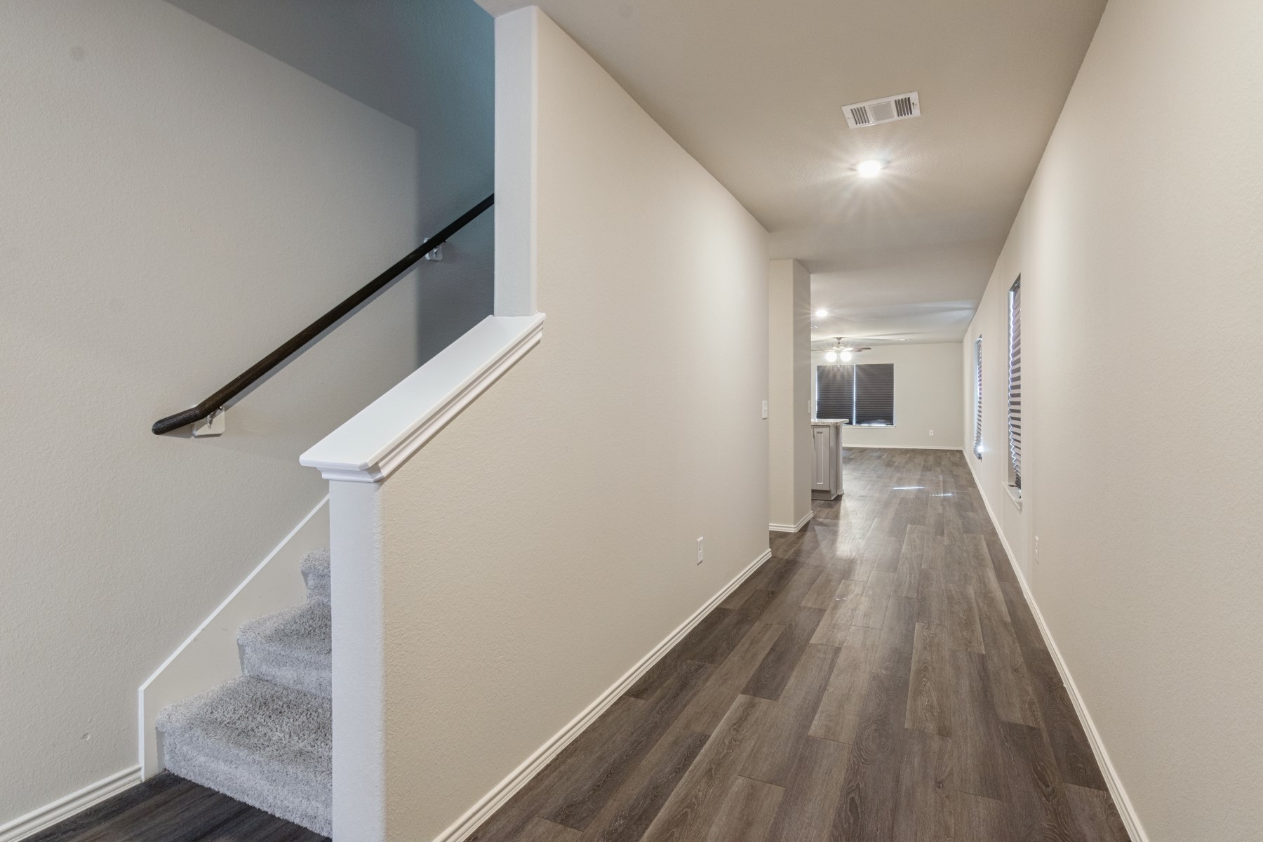 2250 Yelverton Ter Trail Spring, TX 77373 - Photo 5 of 30 a view of a hallway with wooden floor and staircase