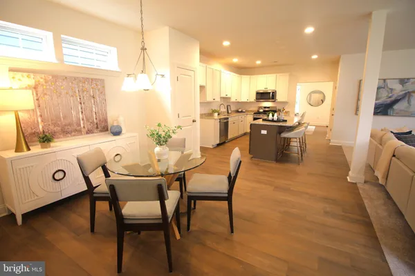 a kitchen with a sink a stove and cabinets