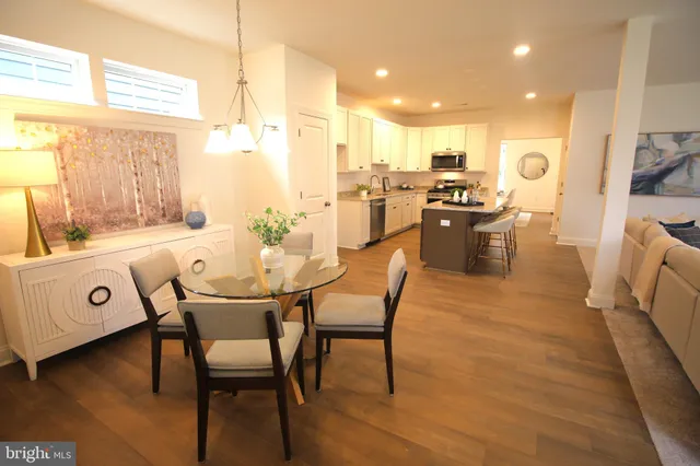 a kitchen with a sink a stove and cabinets