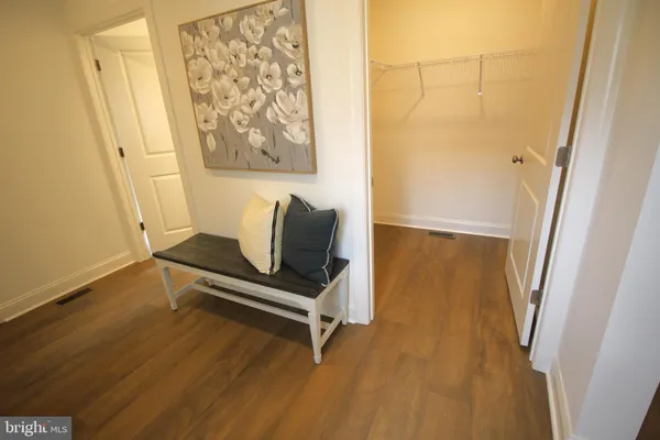 a bedroom with a bed and couch