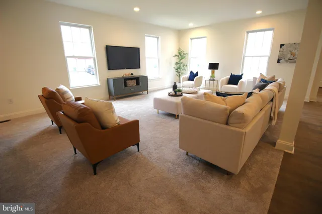 a large kitchen with a table and chairs