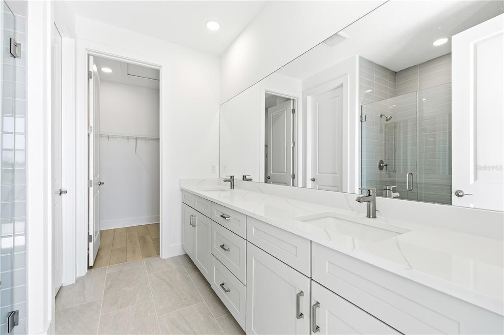 9964 Key Haven Road Seminole, FL 33777 - Photo 24 of 53 a bathroom with double sink and a mirror