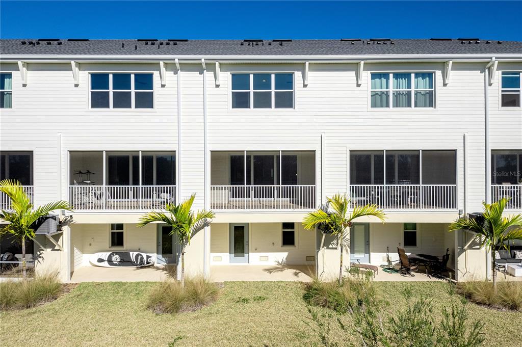 9964 Key Haven Road Seminole, FL 33777 - Photo 40 of 53 a front view of a house with swimming pool and glass windows