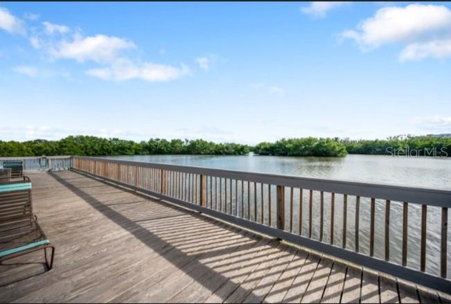 9964 Key Haven Road Seminole, FL 33777 - Photo 45 of 53 a view of balcony with wooden floor and fence