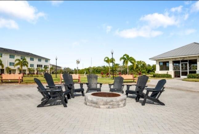 9964 Key Haven Road Seminole, FL 33777 - Photo 47 of 53 a view of a patio with a table and chairs