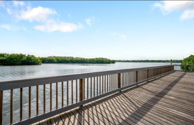 9964 Key Haven Road Seminole, FL 33777 - Photo 48 of 53 a balcony with wooden floor and lake view