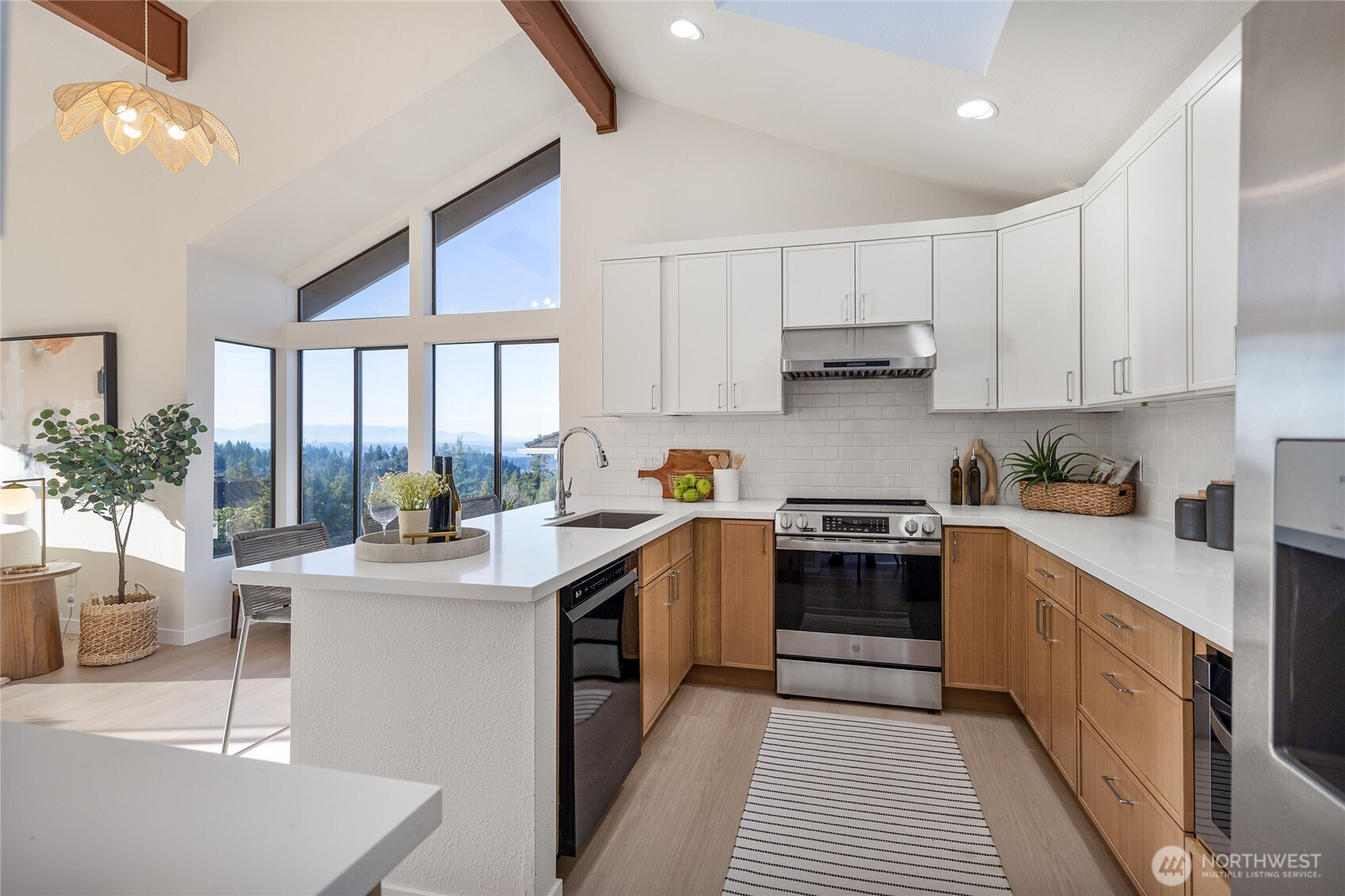 4727 155th Place Southeast Bellevue, WA 98006 - Photo 11 of 38 a kitchen with stainless steel appliances granite countertop a stove a sink dishwasher and a refrigerator