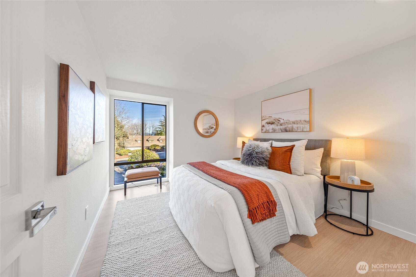 4727 155th Place Southeast Bellevue, WA 98006 - Photo 22 of 38 a bedroom with a bed and a lamp on table