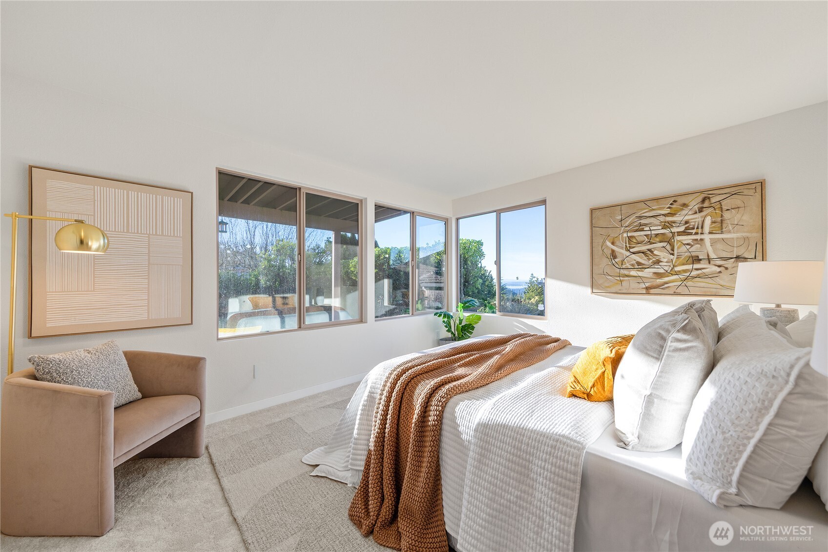 4727 155th Place Southeast Bellevue, WA 98006 - Photo 27 of 38 a bed sitting in a bedroom next to a window