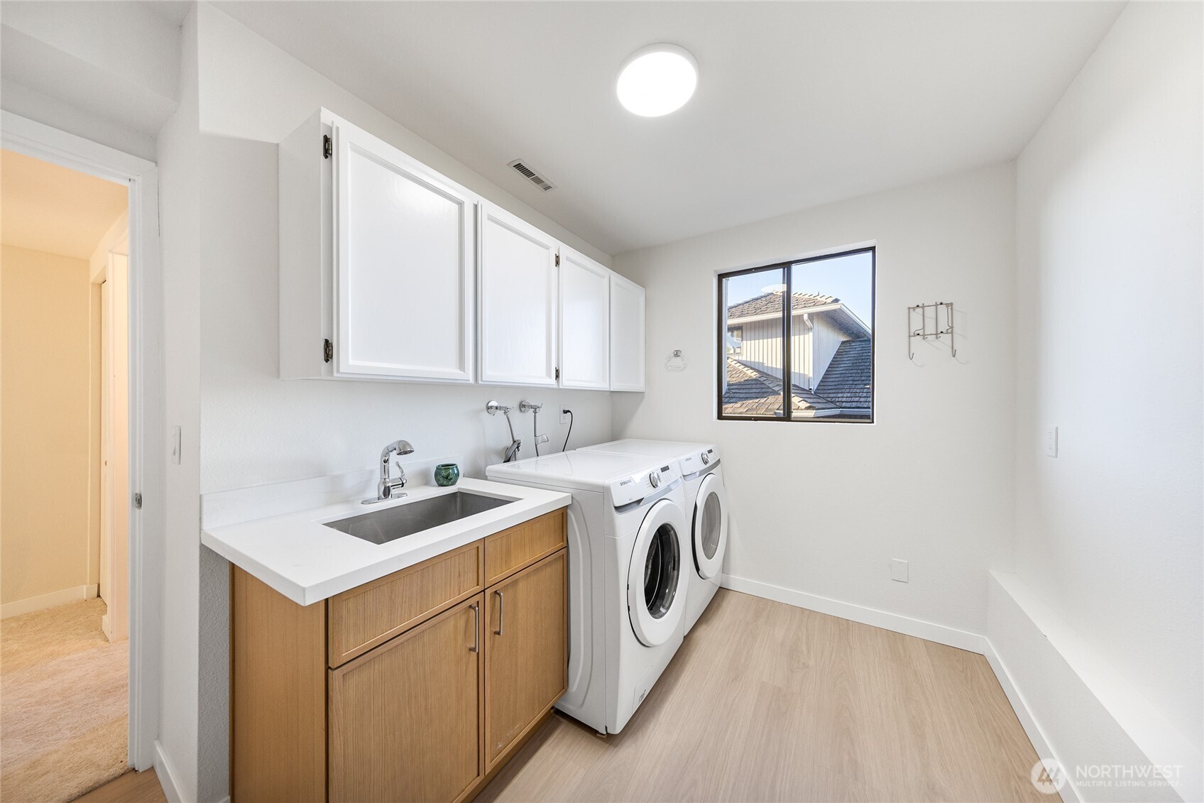 4727 155th Place Southeast Bellevue, WA 98006 - Photo 30 of 38 a utility room with sink dryer and washer