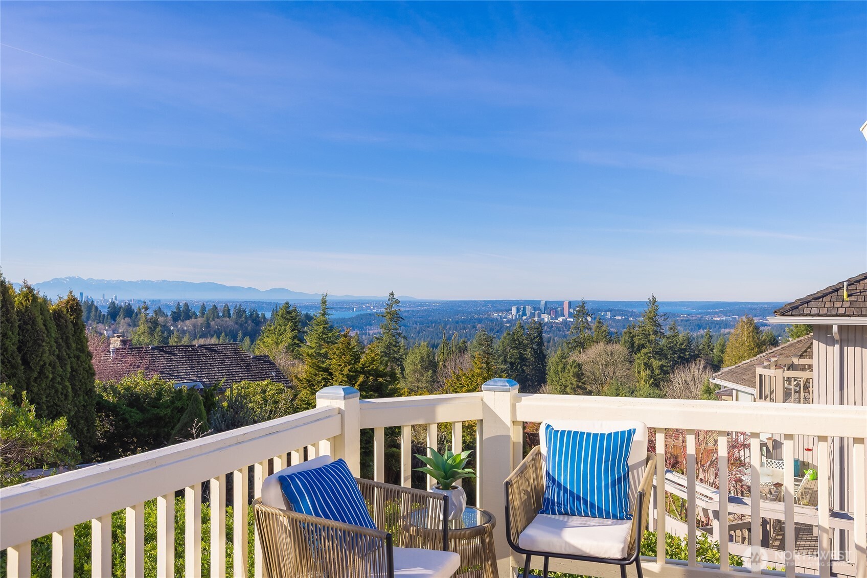 4727 155th Place Southeast Bellevue, WA 98006 - Photo 6 of 38 a view of a balcony with wooden chairs and city view