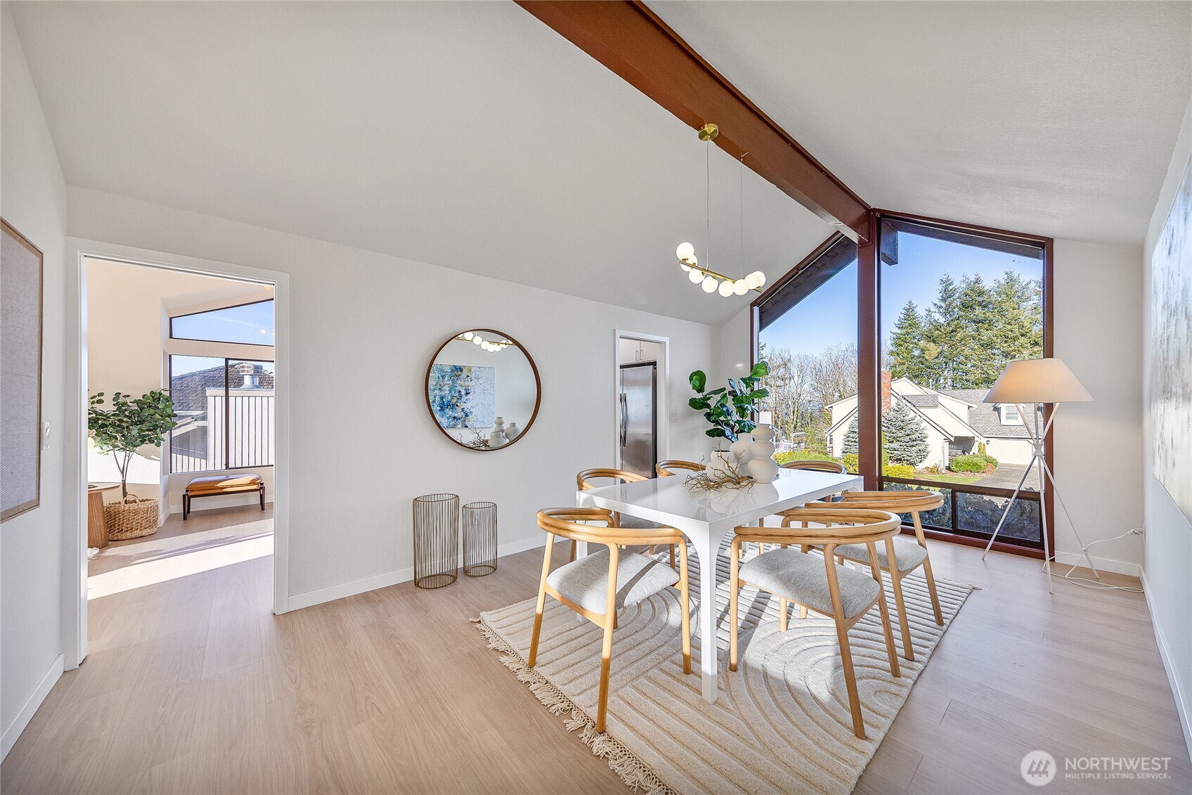 4727 155th Place Southeast Bellevue, WA 98006 - Photo 9 of 38 a view of a dining room with furniture window and wooden floor