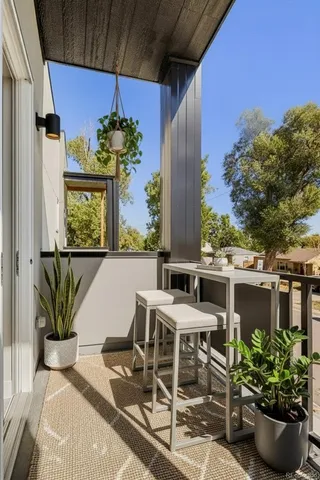 a view of a chairs and table in a patio