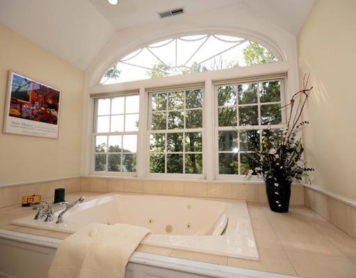 130 Long Neck Point Road Darien, CT 06820 - Photo 15 of 20 a bathroom with a bathtub and a window