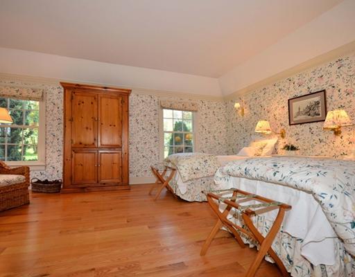130 Long Neck Point Road Darien, CT 06820 - Photo 16 of 20 a spacious bedroom with a bed and large windows