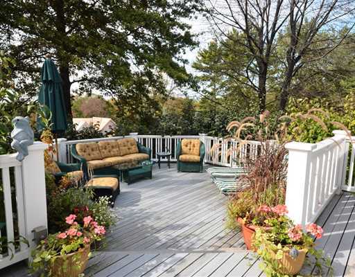 130 Long Neck Point Road Darien, CT 06820 - Photo 19 of 20 a terrace of a house with outdoor seating
