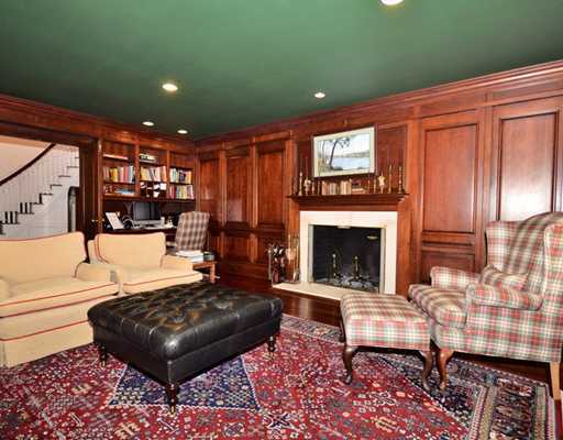 130 Long Neck Point Road Darien, CT 06820 - Photo 7 of 20 a living room with furniture and a fireplace